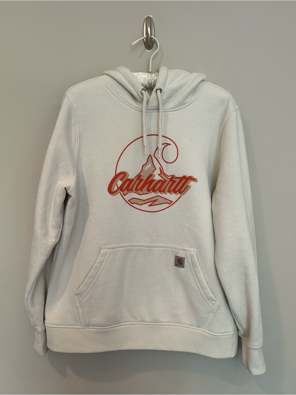Women’s Carhartt Cream Pullover Hoodie with orange Mountain Logo. Size Lg